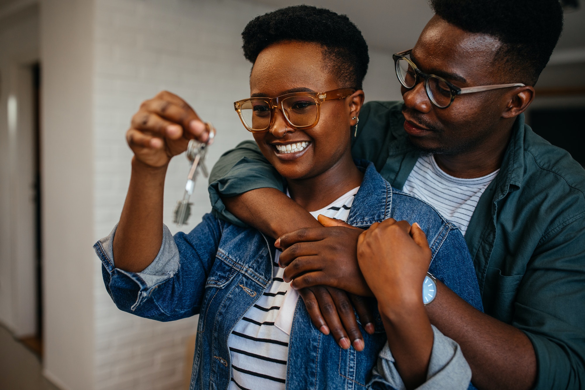 Couple holding the keys of their new house